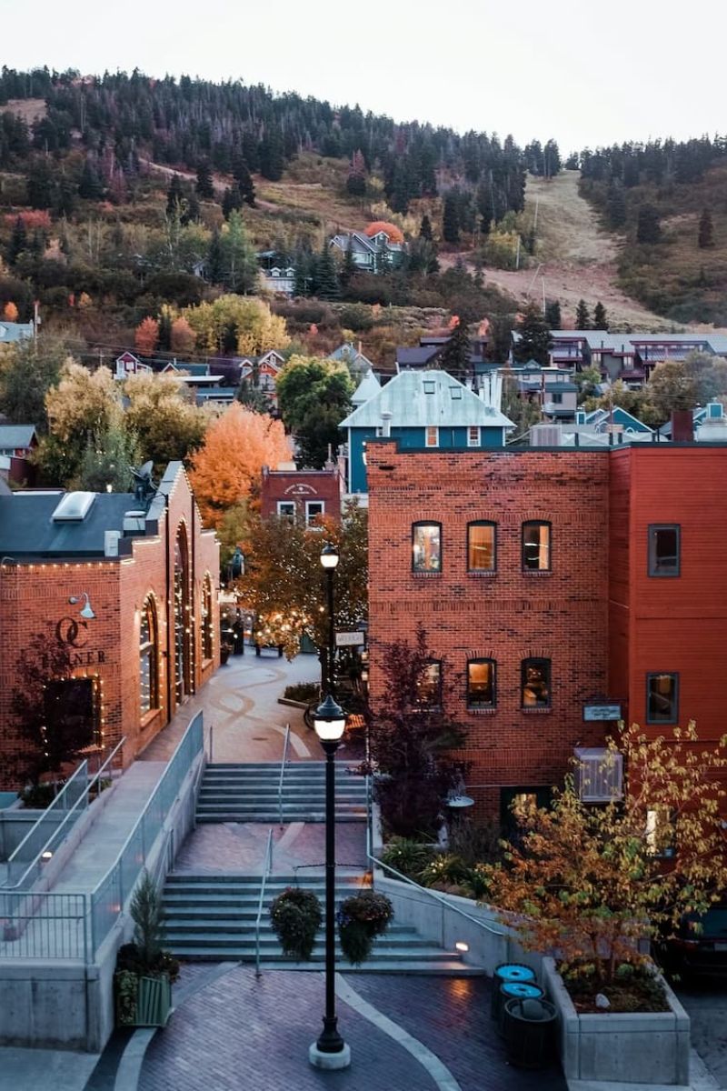 Park City historic Main Street with brick buildings and ski runs above