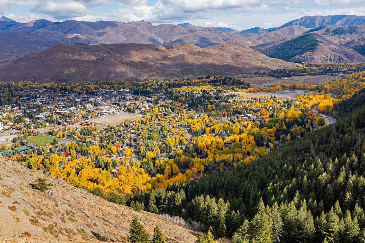 Aerial view of Sun Valley Idaho town surrounded by autumn aspens and mountains