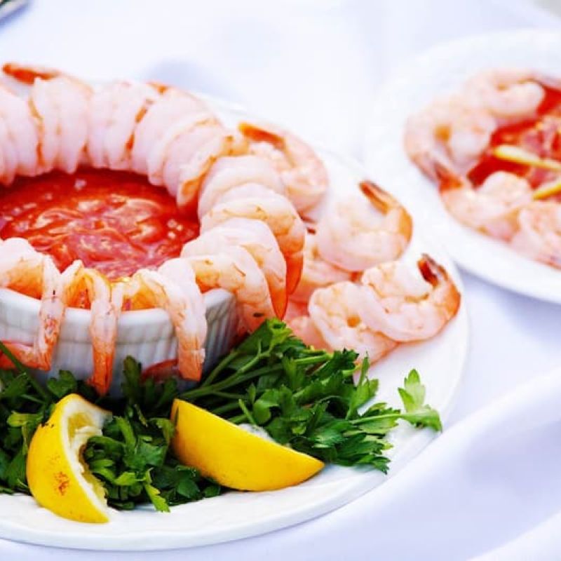 Chilled shrimp ring with cocktail sauce and lemon wedges