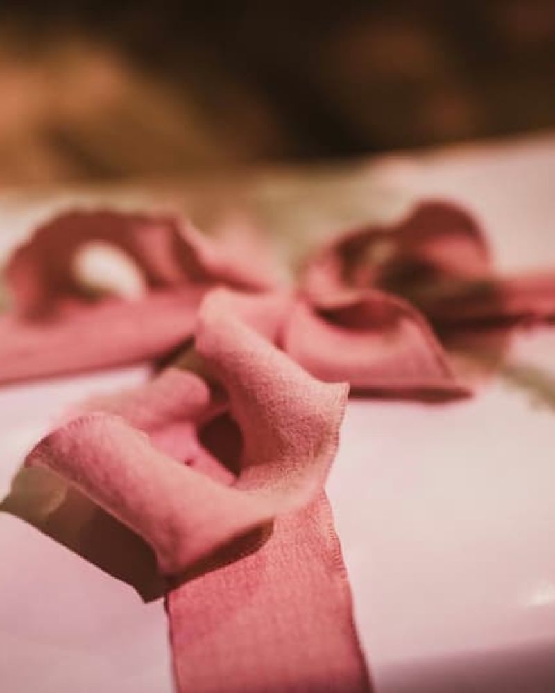 Wrapped gift tied with a soft pink ribbon