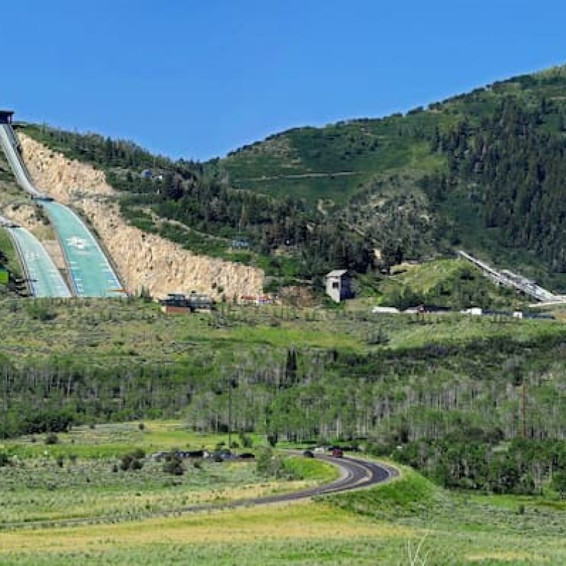 Utah Olympic Park ski jump ramps on a green summer hillside near Park City
