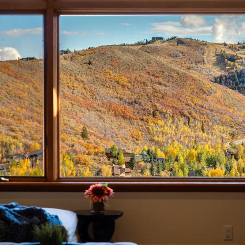 Window view of autumn aspen hillsides and Park City ski runs