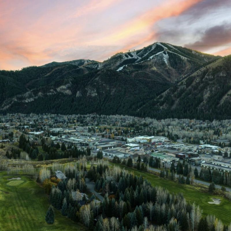 Aerial view of Sun Valley town and Bald Mountain ski runs at sunset