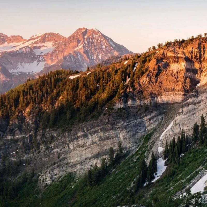 Sunlit cliffs and snow-streaked peaks of the Sawtooth Mountains near Sun Valley Idaho